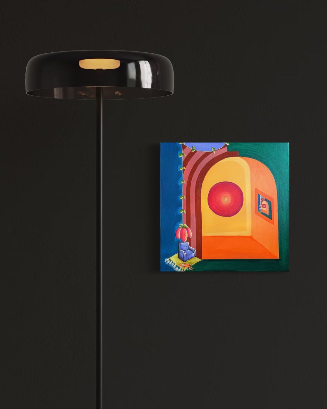 Black floor lamp next to a square painting with abstract shapes and colors: orange, red, green, blue.