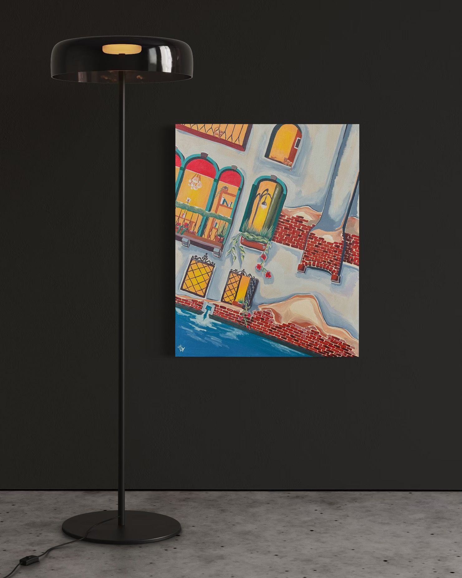 A black floor lamp next to a painting depicting a building with colorful windows.