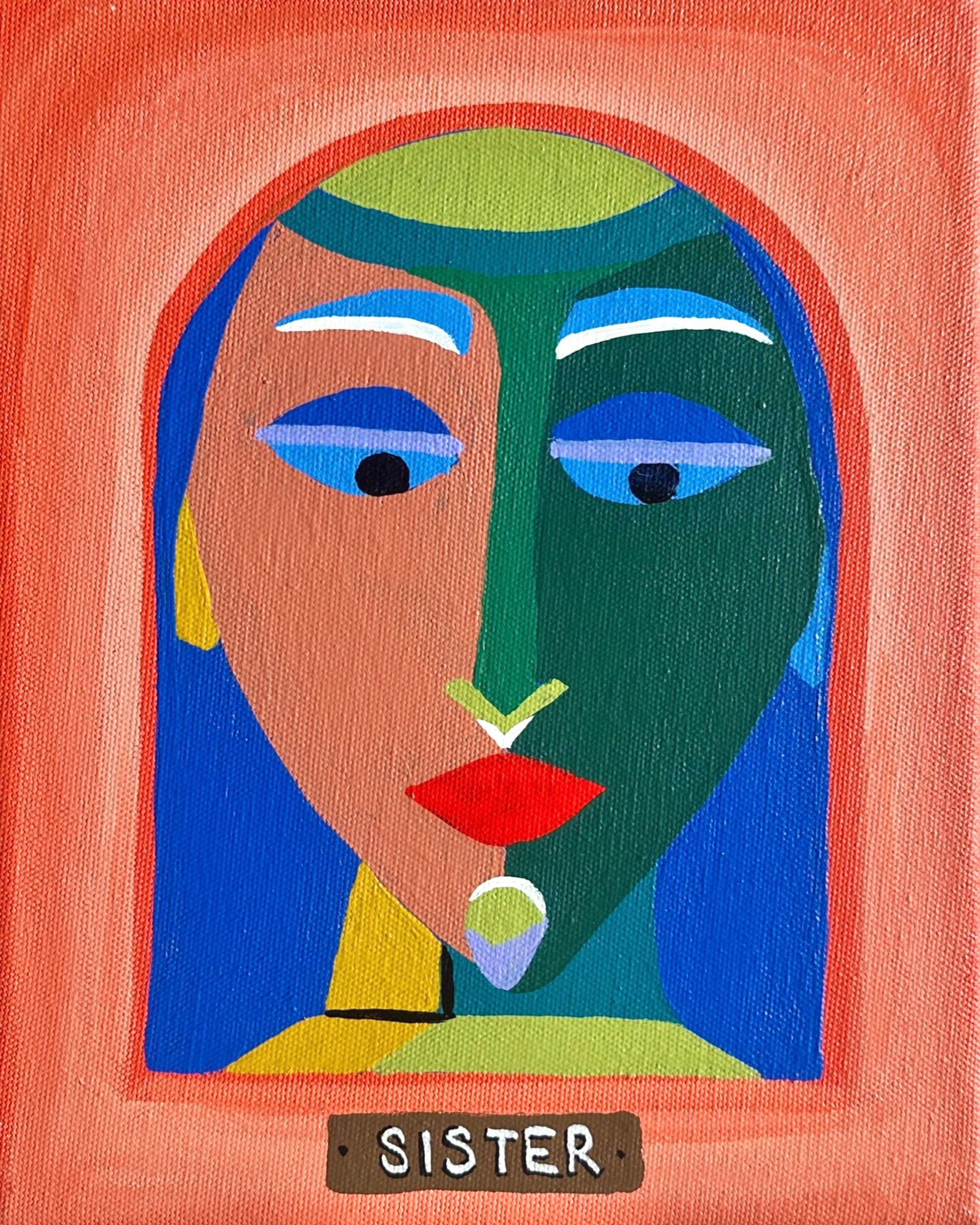 Abstract face divided into colors, red lips. Below is a rectangular sign: 