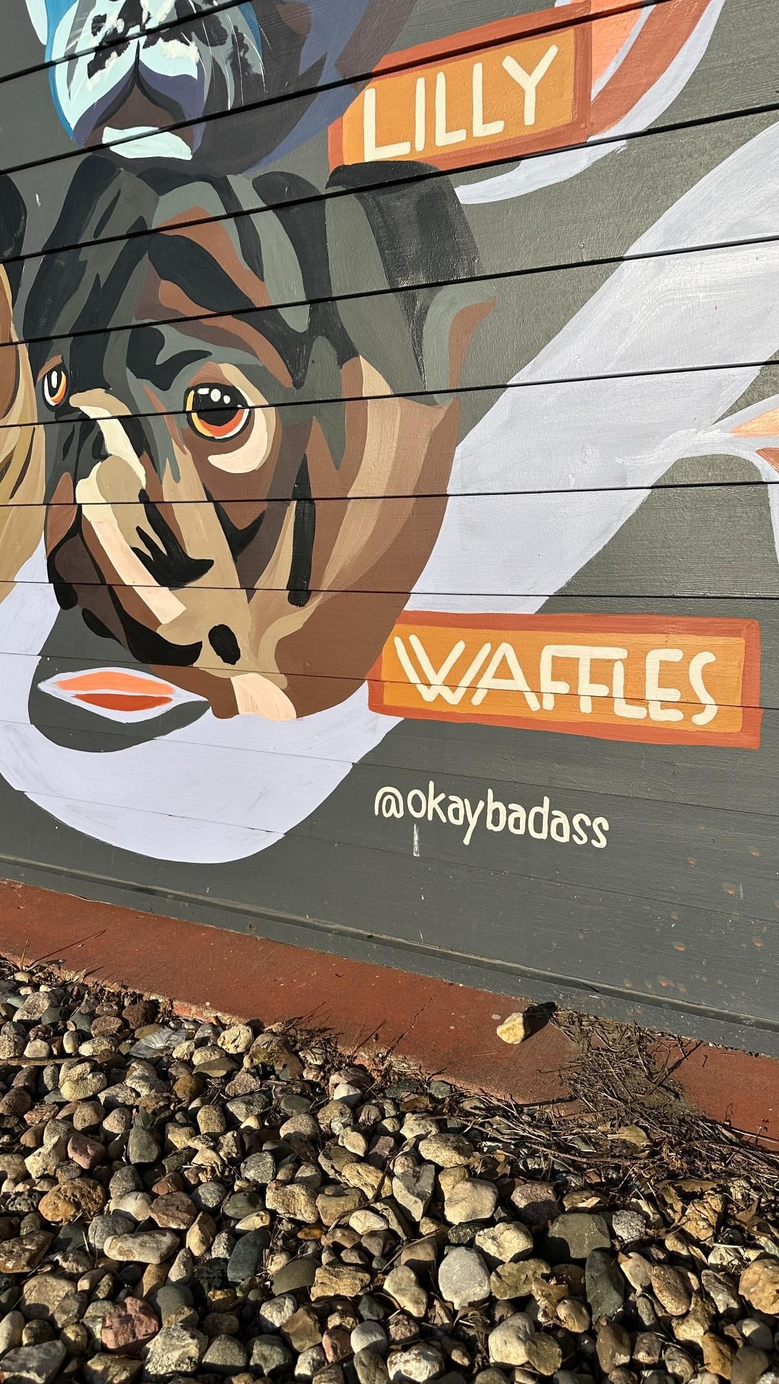 Mural of a dog with the text 