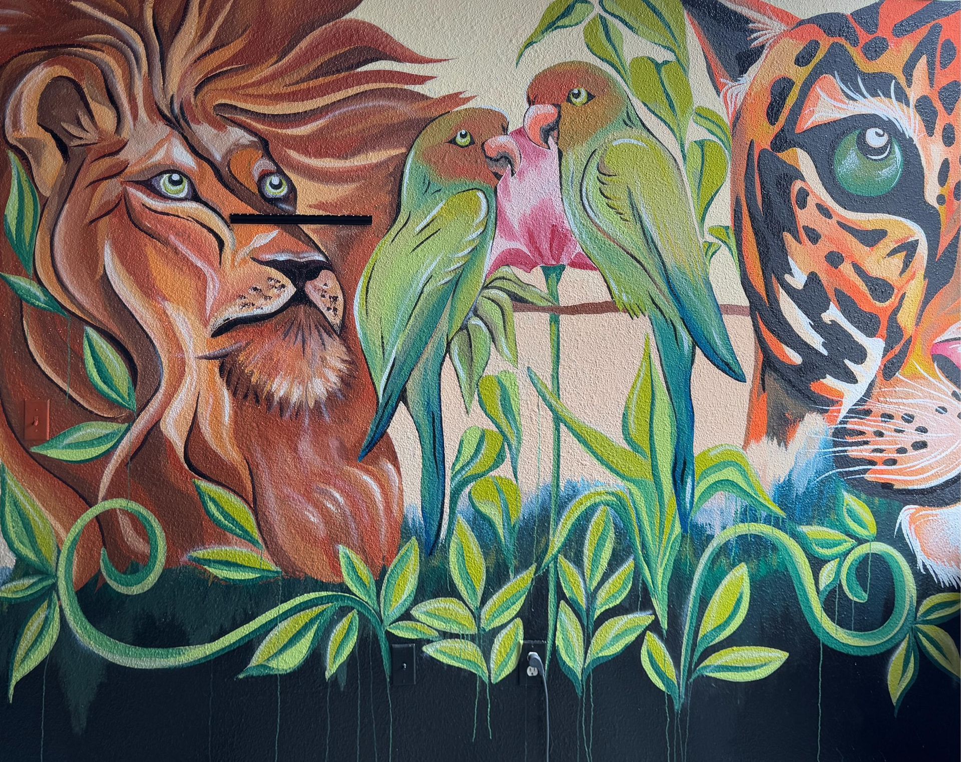 Mosaic artwork: lion, two parrots, leopard, tropical plants.