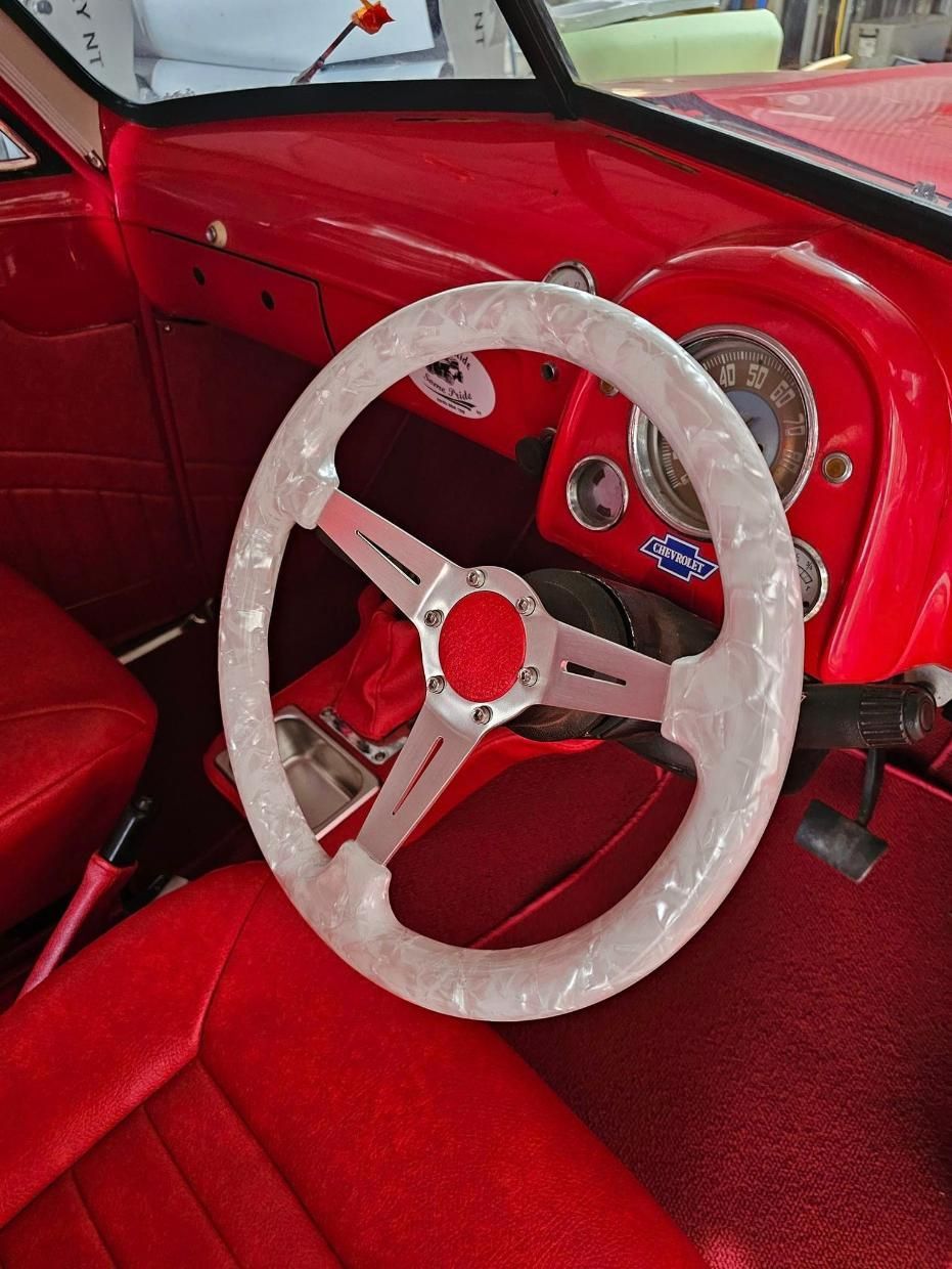 A Red Car With A White Steering Wheel And Red Seats — All Car Upholstery In Pinelands, NT