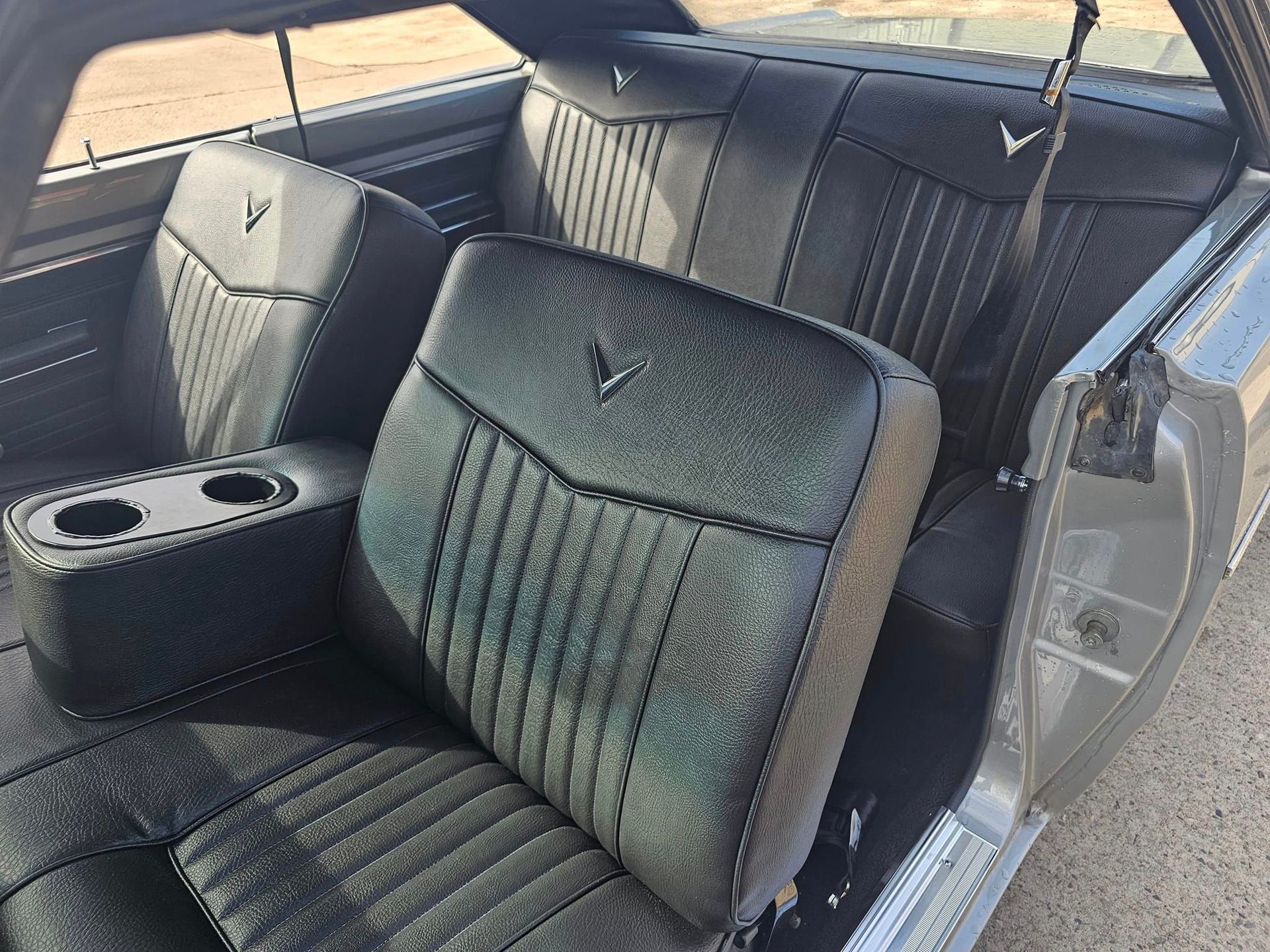 A Light Blue Sports Car Is Parked In A Parking Lot — All Car Upholstery In Pinelands, NT