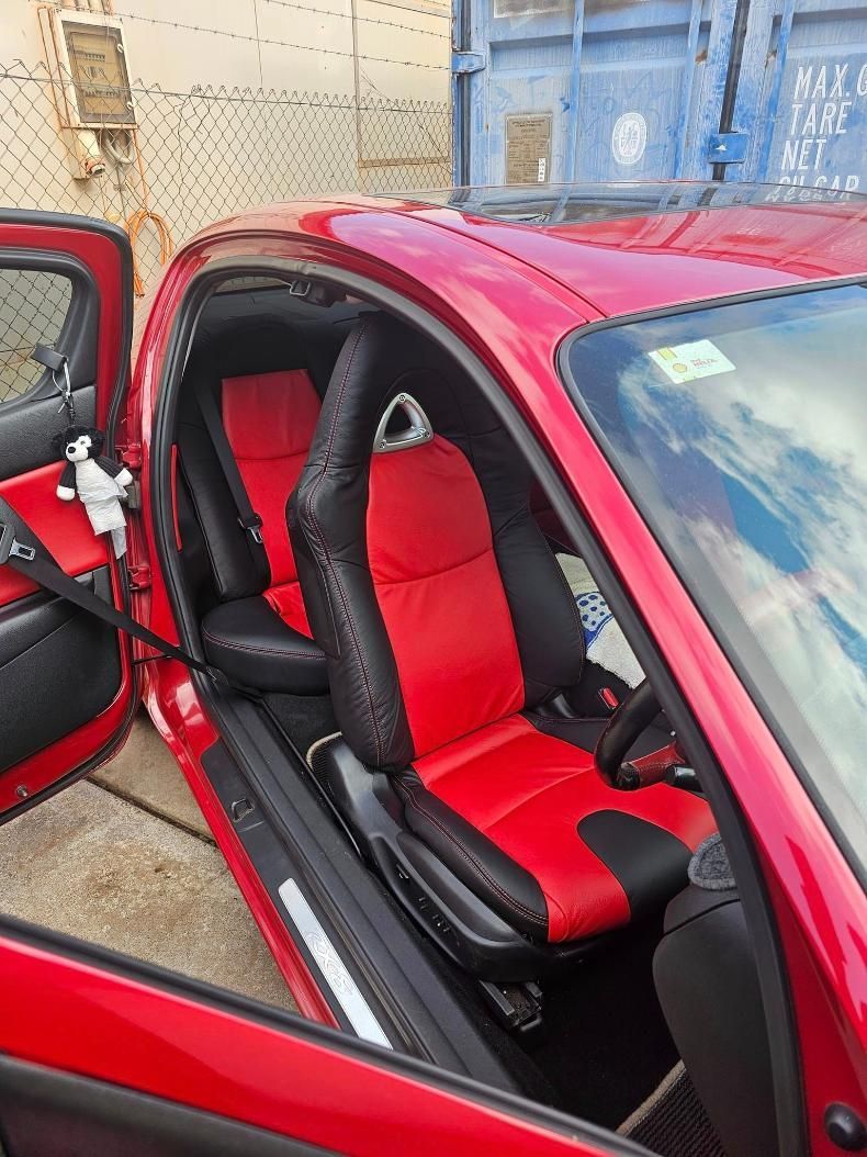 A Red Car With Black Seats And The Door Open — All Car Upholstery In Pinelands, NT