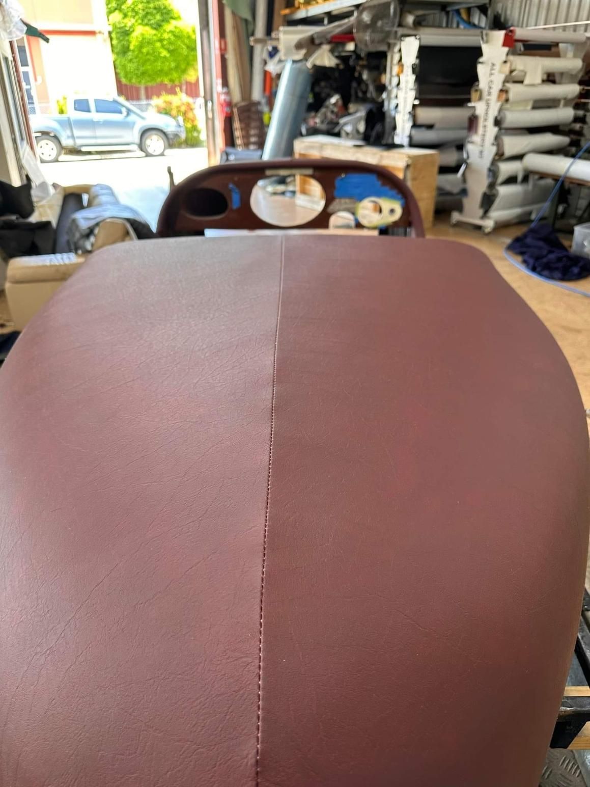 A Large Piece Of Brown Leather Is Sitting In A Garage — All Car Upholstery In Pinelands, NT