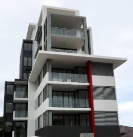 The outside view of an apartment block with lots of windows — Commercial Painting Group in Kembla Grange, NSW