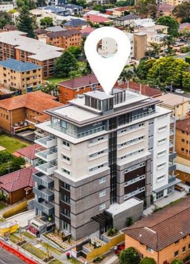 An aerial view of a grey and white apartment building — Commercial Painting Group in Kembla Grange, NSW
