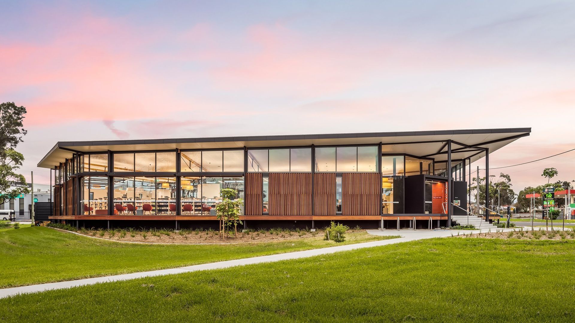 The side view of a large library and a grassy field — Commercial Painting Group in Kembla Grange, NSW