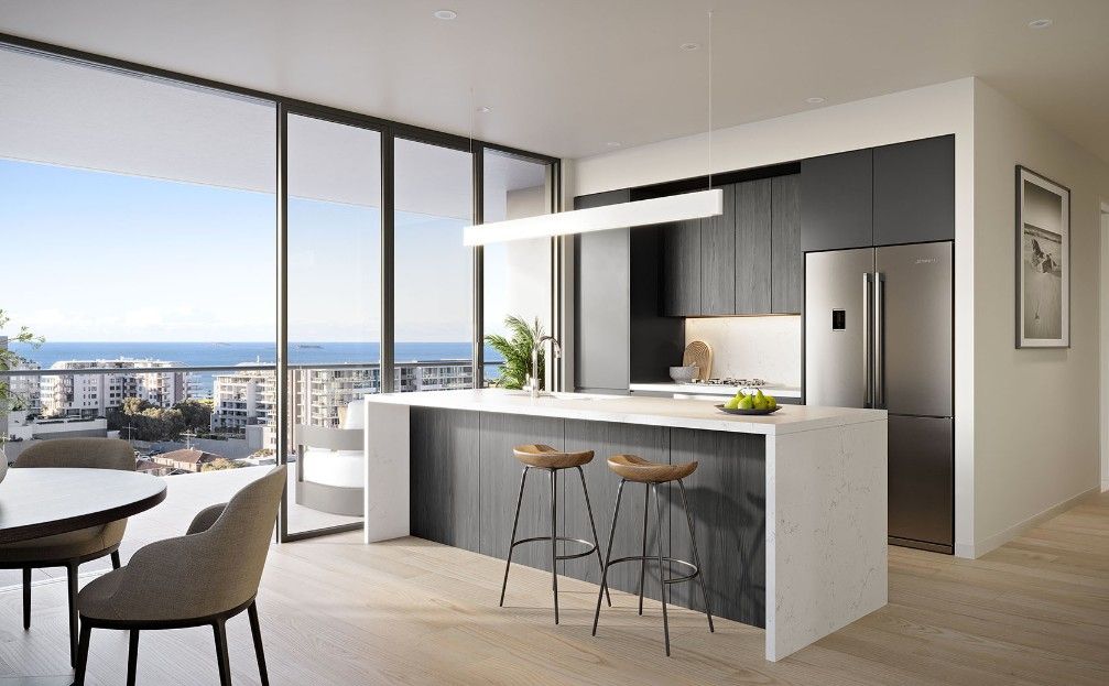 A kitchen and table with chairs overlooking a city — Commercial Painting Group in Kembla Grange, NSW