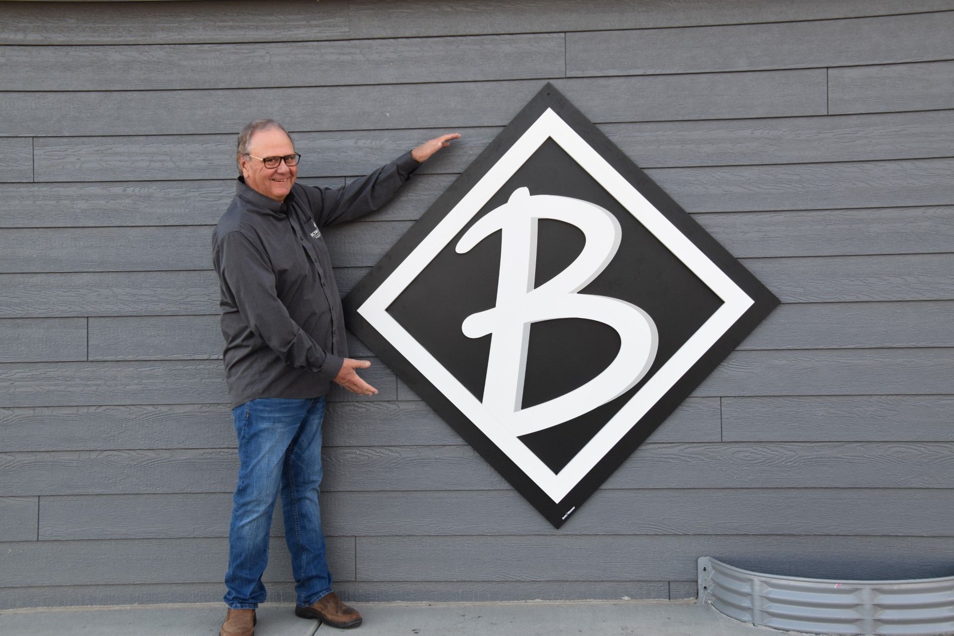 Man pointing at a large, white