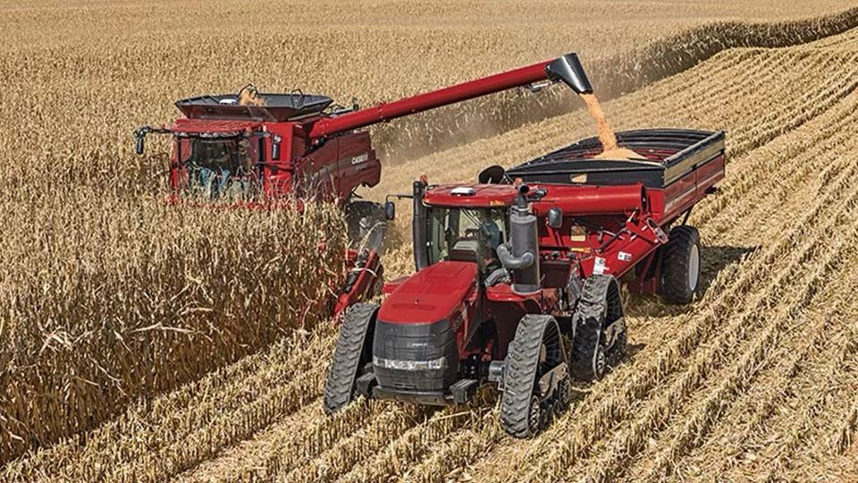 A white house with a porch and a chimney