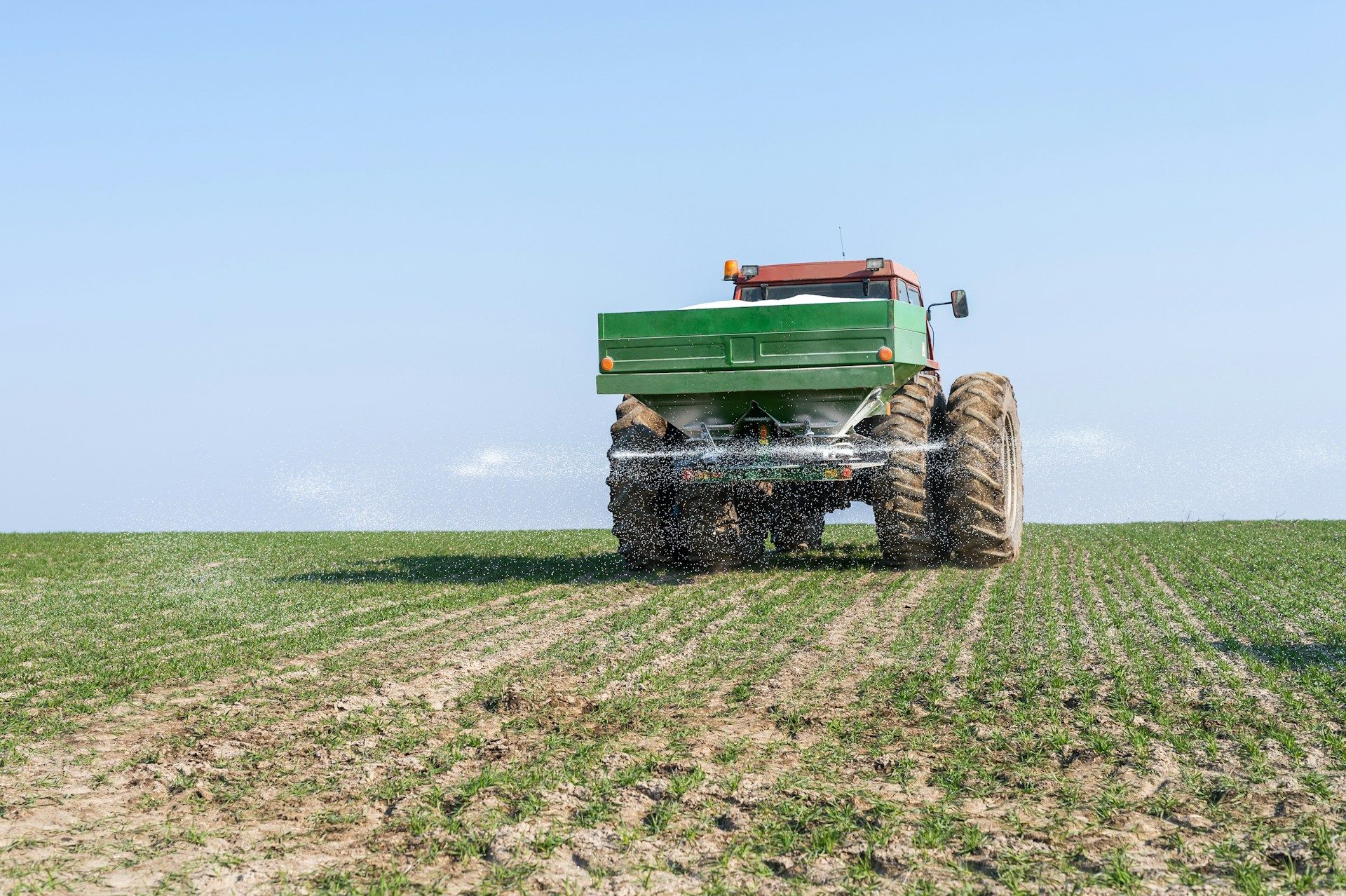 A white house with a porch and a chimney