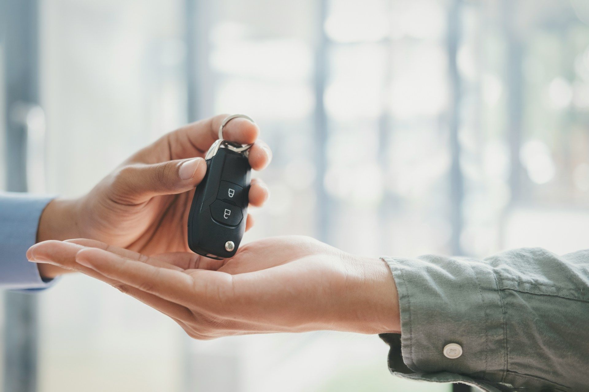 A white house with a porch and a chimney