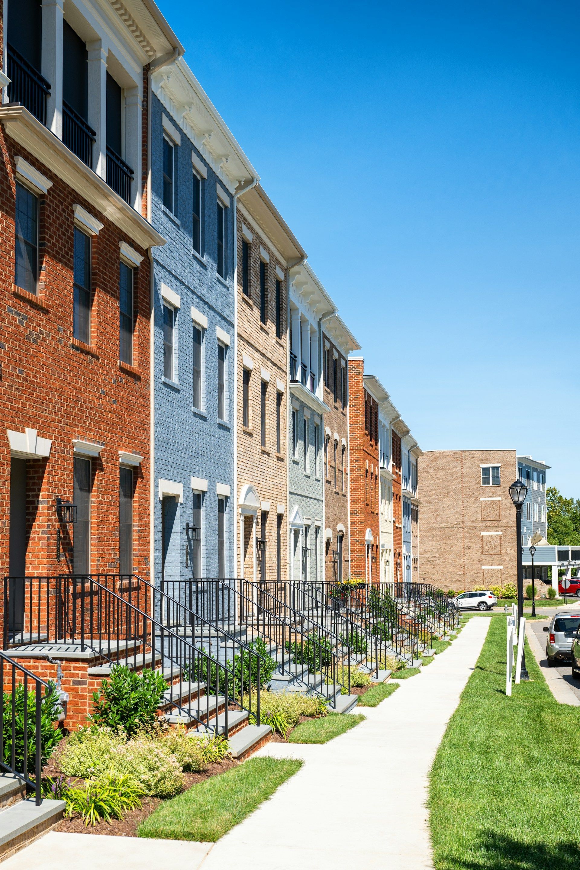 A white house with a porch and a chimney