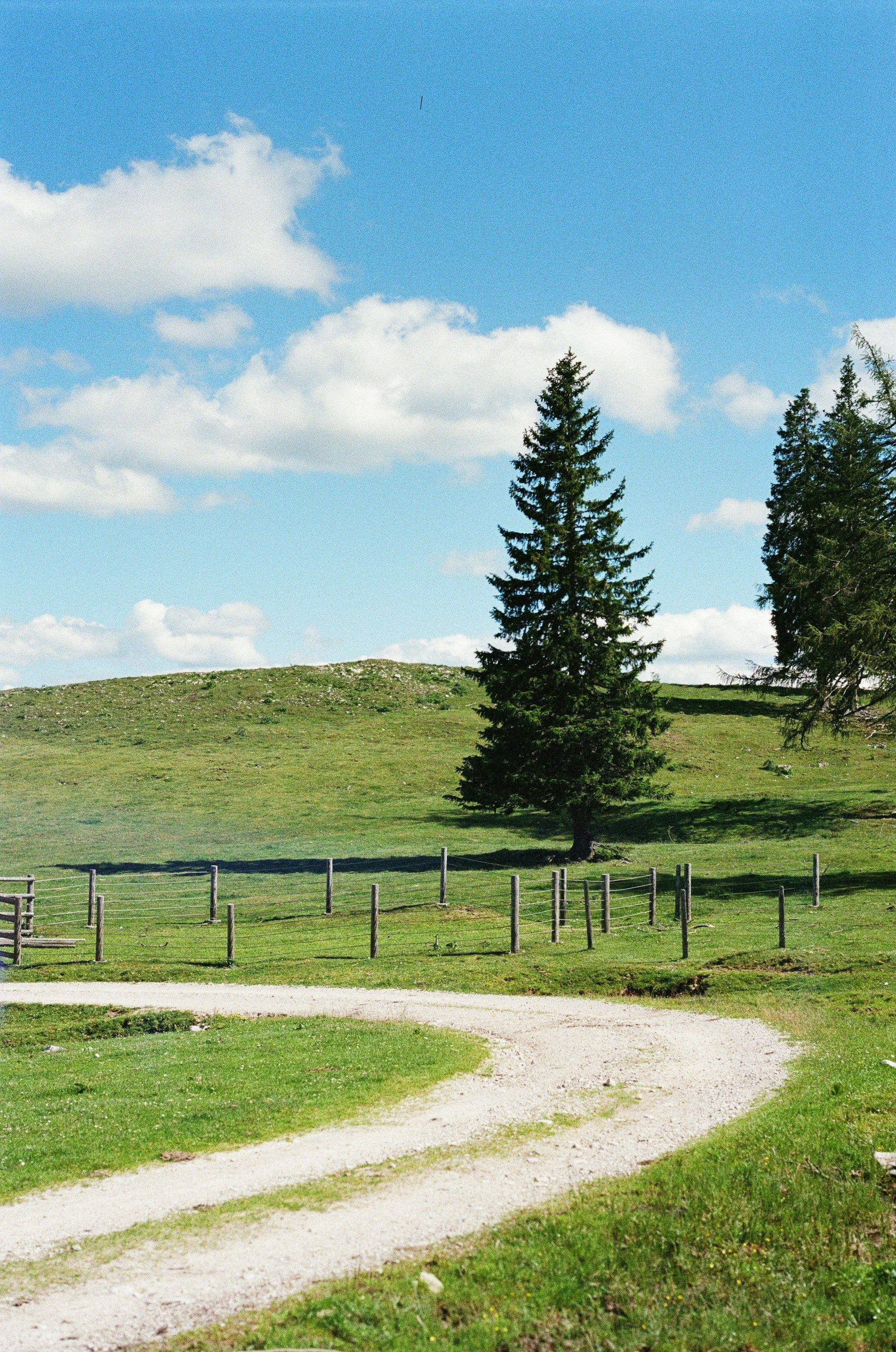 A white house with a porch and a chimney