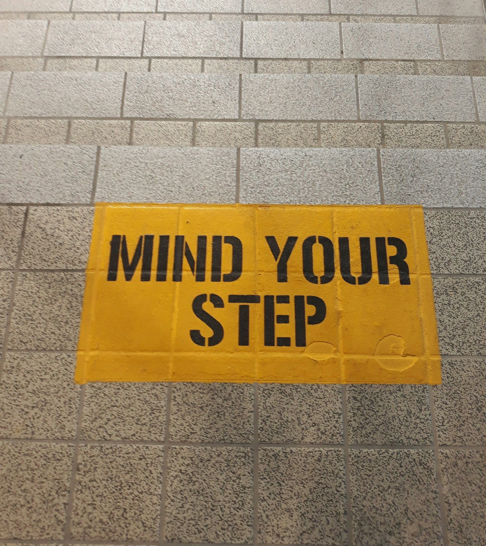 A white house with a porch and a chimney