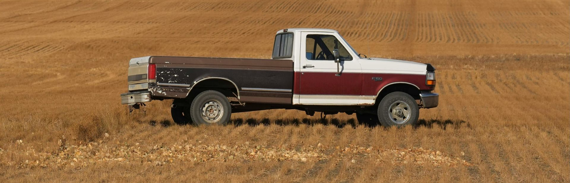 A white house with a porch and a chimney