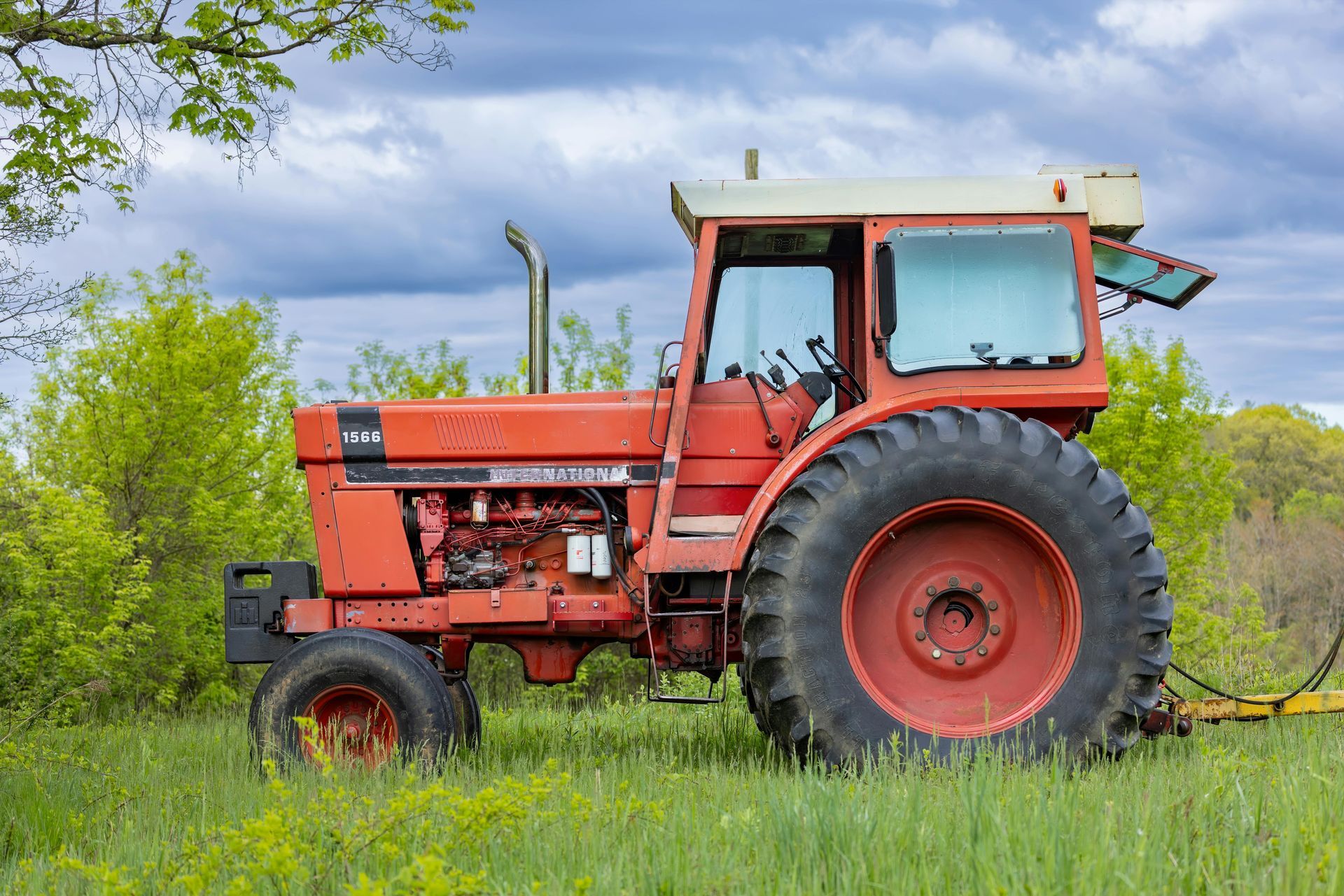 A white house with a porch and a chimney