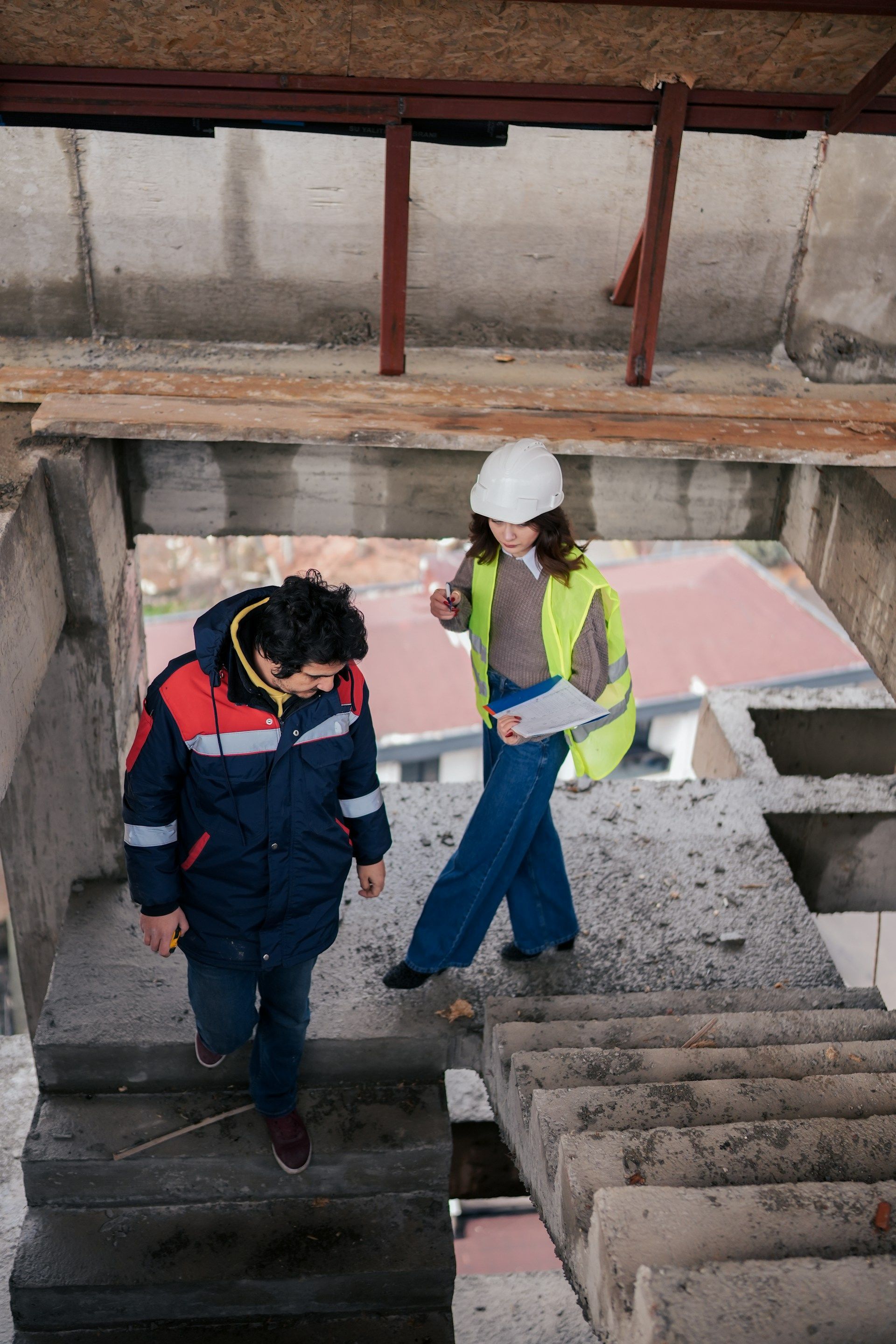 A white house with a porch and a chimney