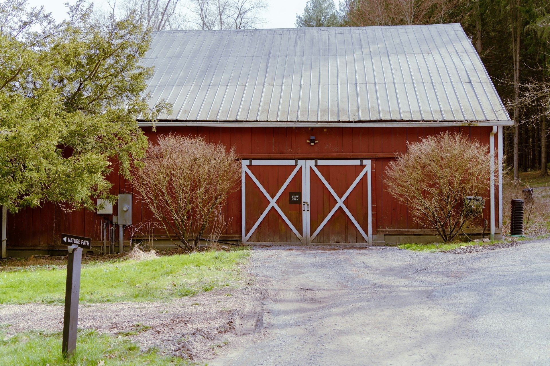 A white house with a porch and a chimney