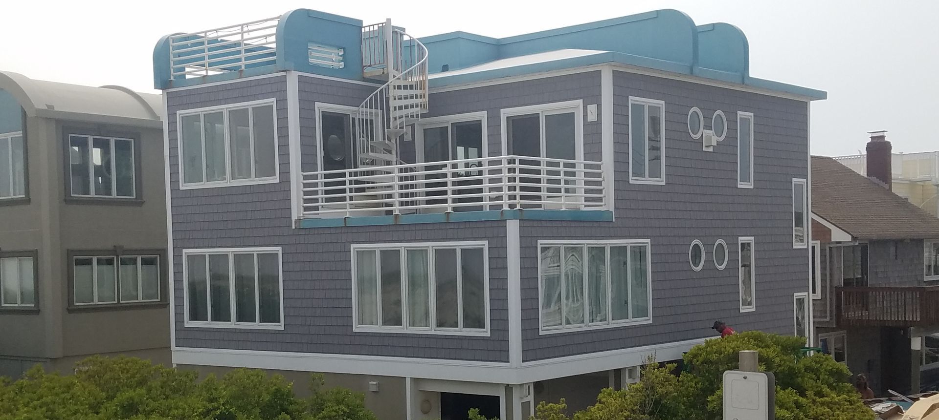 A large building with a lot of windows and a fire escape