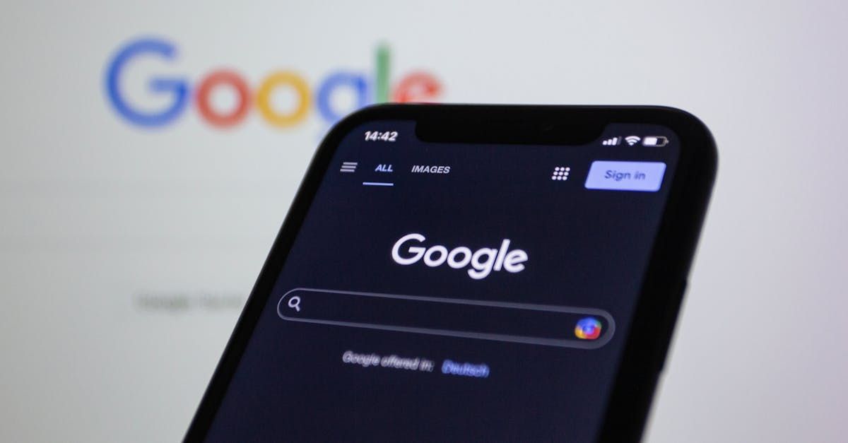 Smartphone displaying the Google search page, with the Google logo in the background.