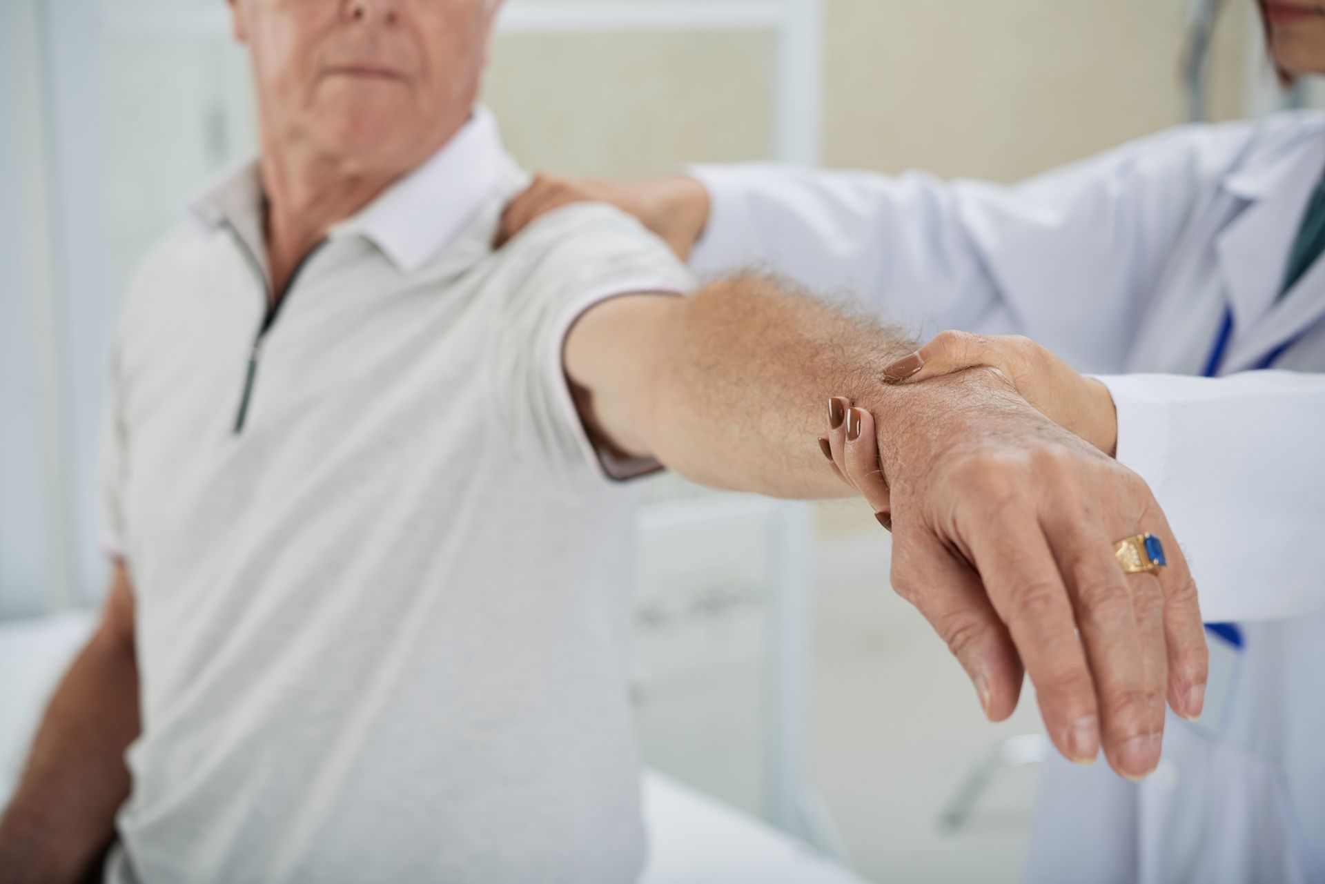 elderly man getting physio therapy