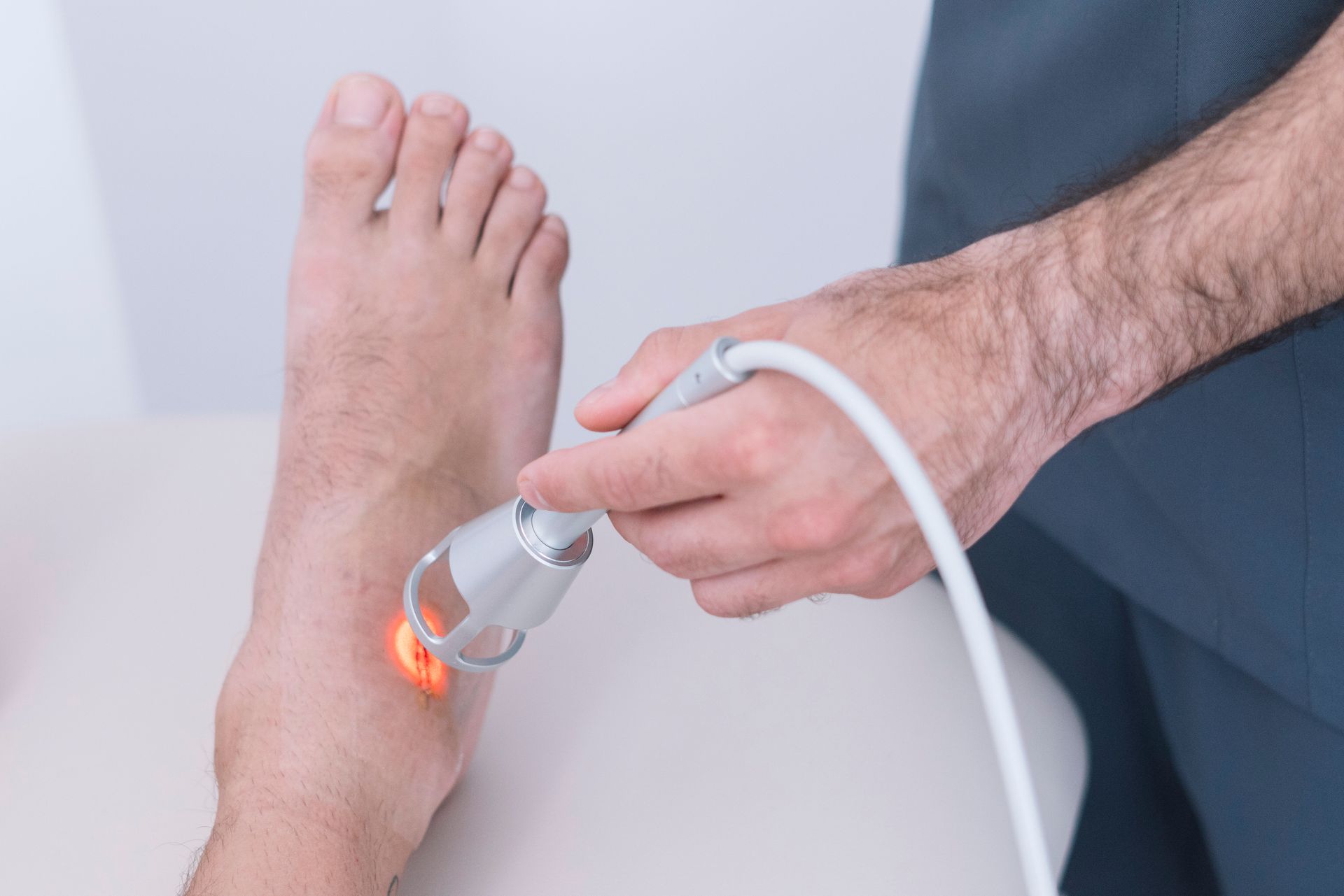 physiotherapist using cold laser