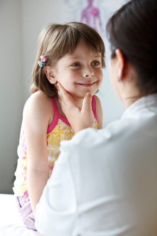Paediatric Physiotherapist talking to young child