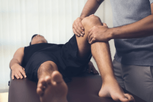 physiotherapist working on knee