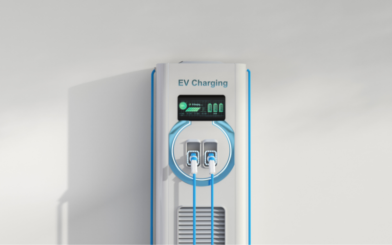 a white and blue electric vehicle charging station on a white wall .