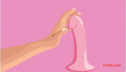 Female adult toys designed to enhance self-love and confidence, featuring a hand gently holding a pink dildo, symbolizing empowerment, personal well-being, and positive sexual health.