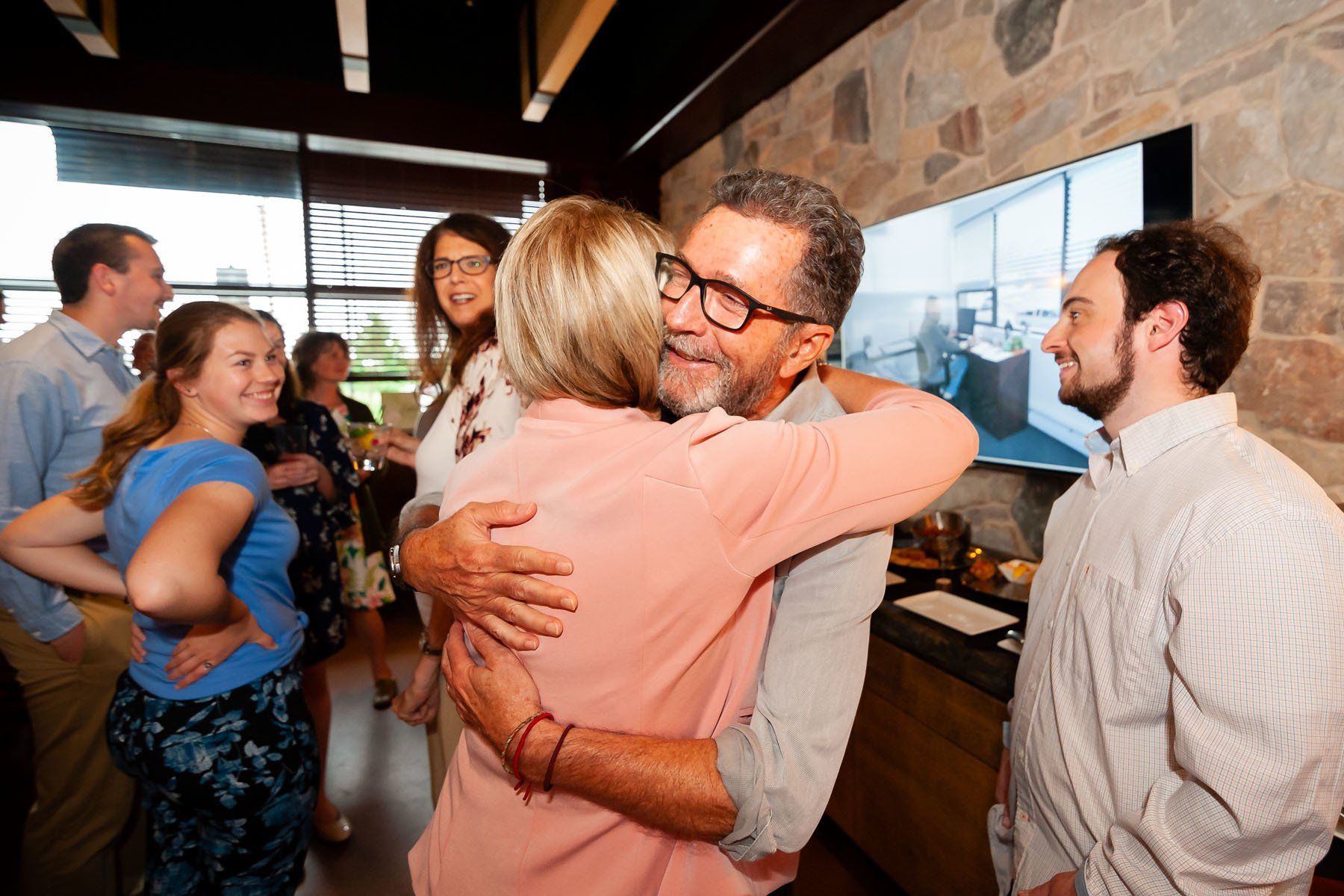 Rob gives Cindy a hug at his Retirement Celebration