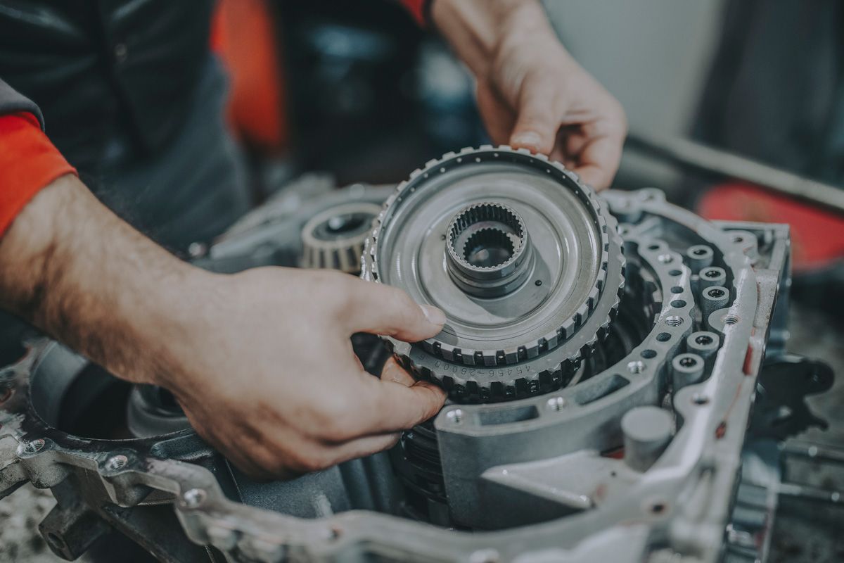 One of our expert technicians working on a transmission.