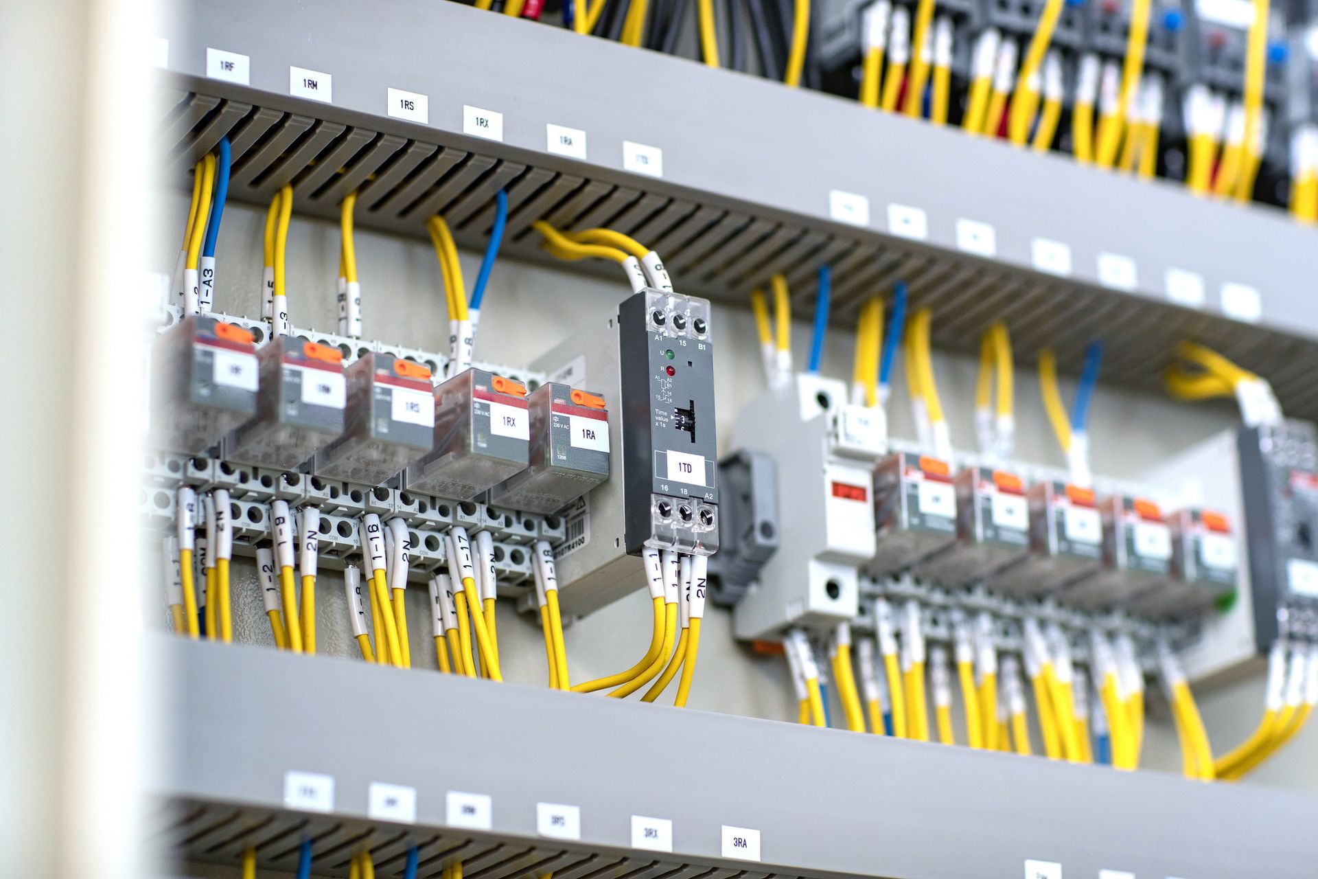 A close up of a electrical panel with lots of wires.