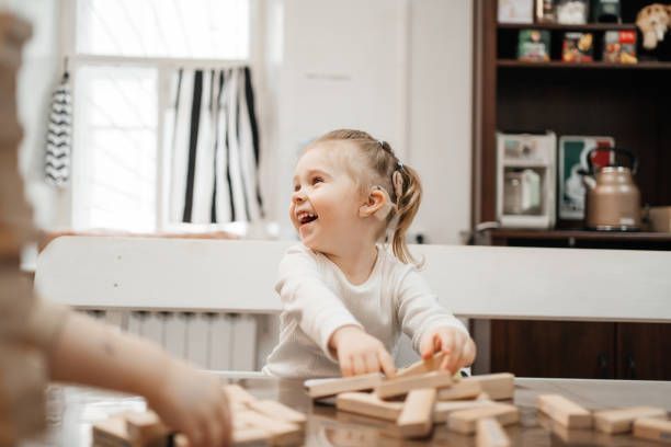 Happy Child Wearing a Hearing Aid — Brooklyn, NY — Urban Hearing