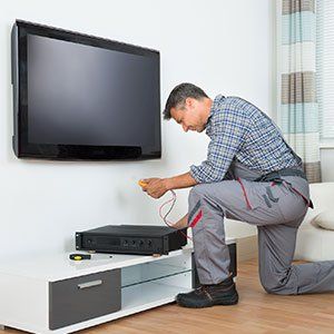 Tv Repair — Technician Installing TV Set in Fairdale, KY
