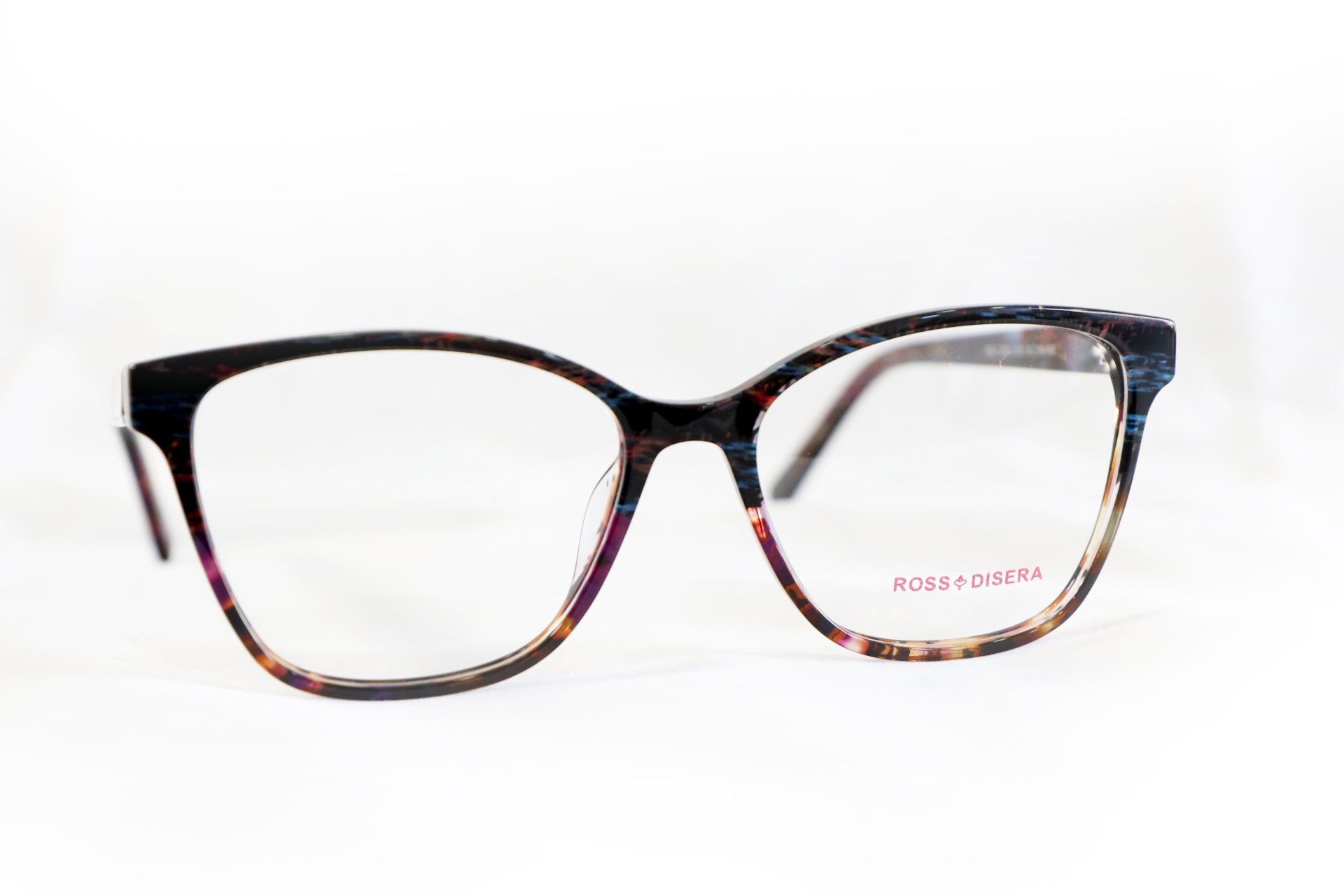 Paio di occhiali con motivo floreale nero e multicolore, su sfondo bianco.