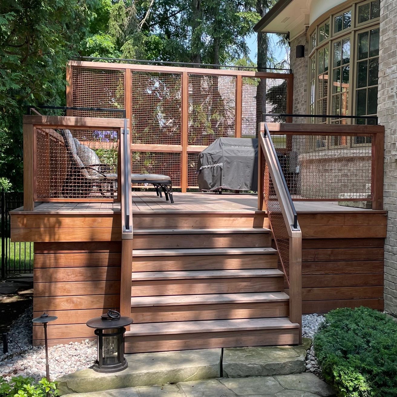 A wooden deck with stairs leading up to it