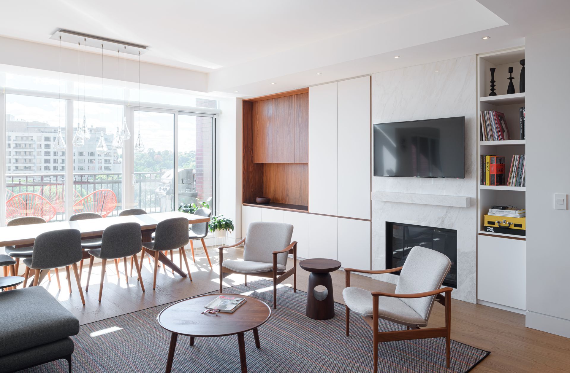 A living room with a fireplace and a flat screen tv