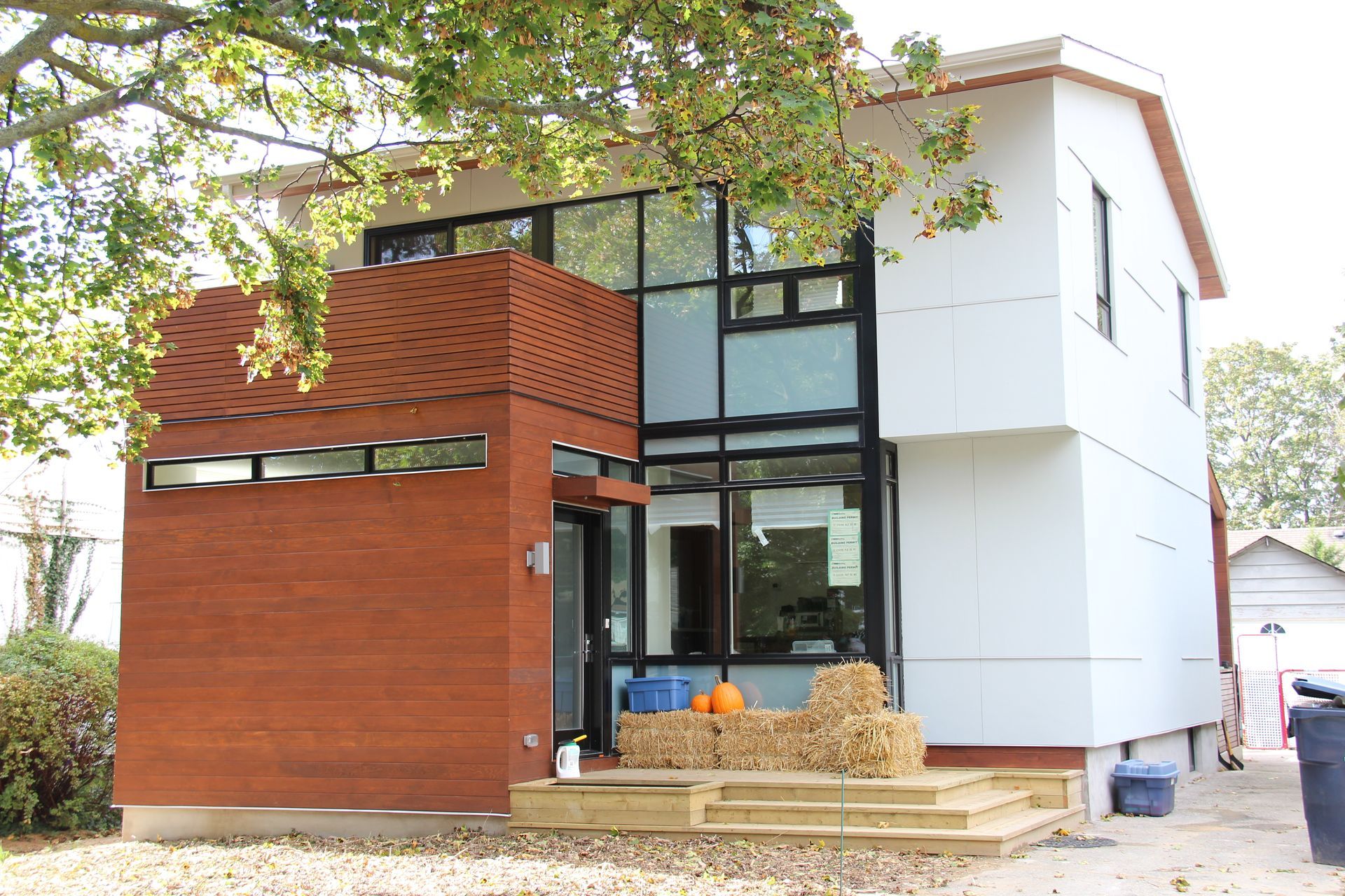 A house with a lot of windows and a brick facade