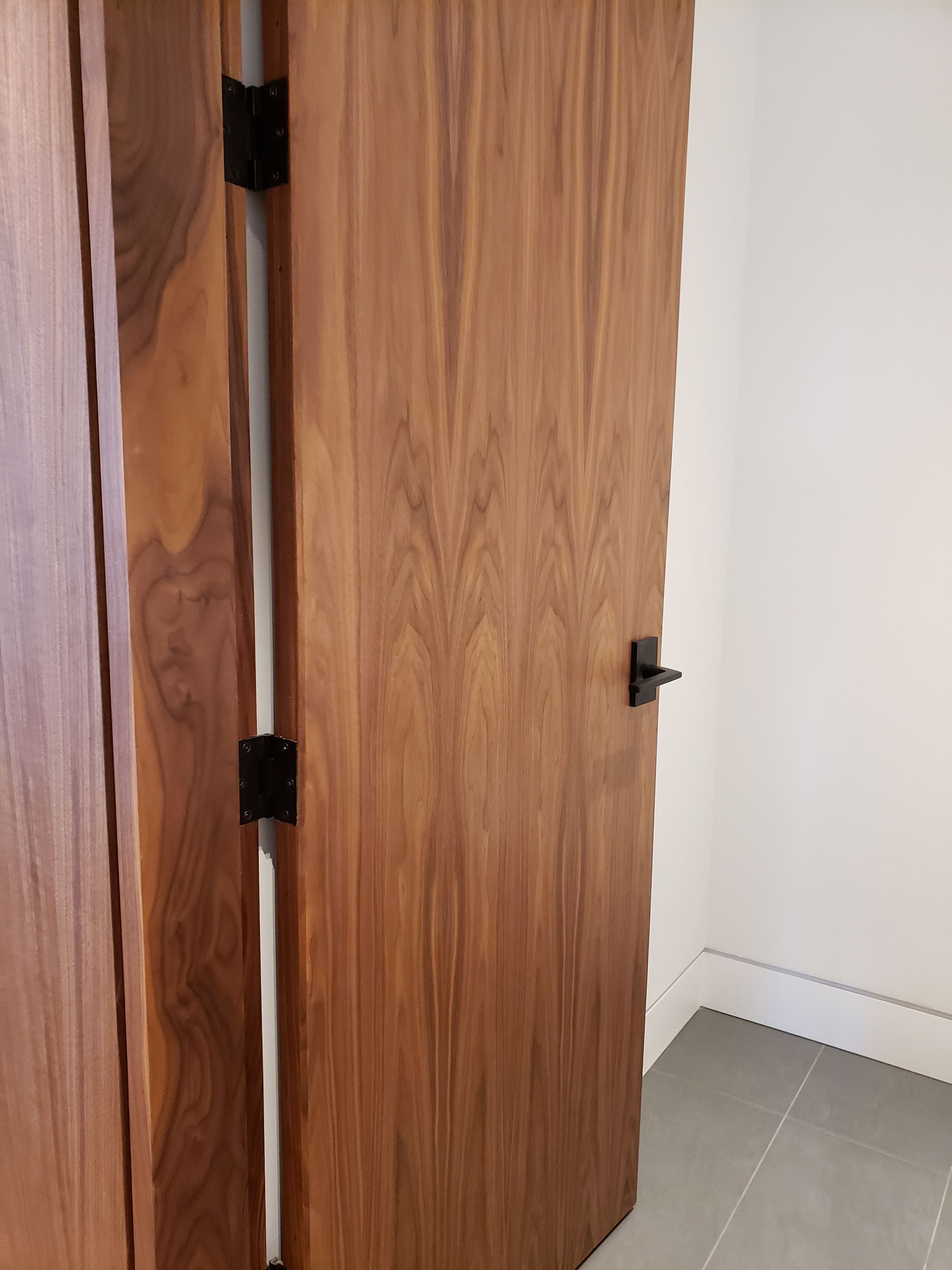 A close up of a wooden door in a room.