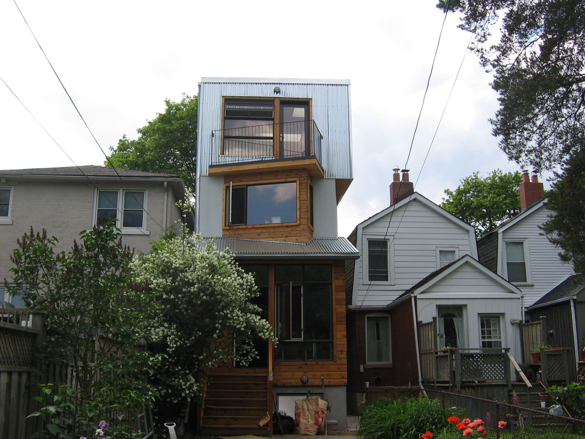 A house with a balcony on the top of it