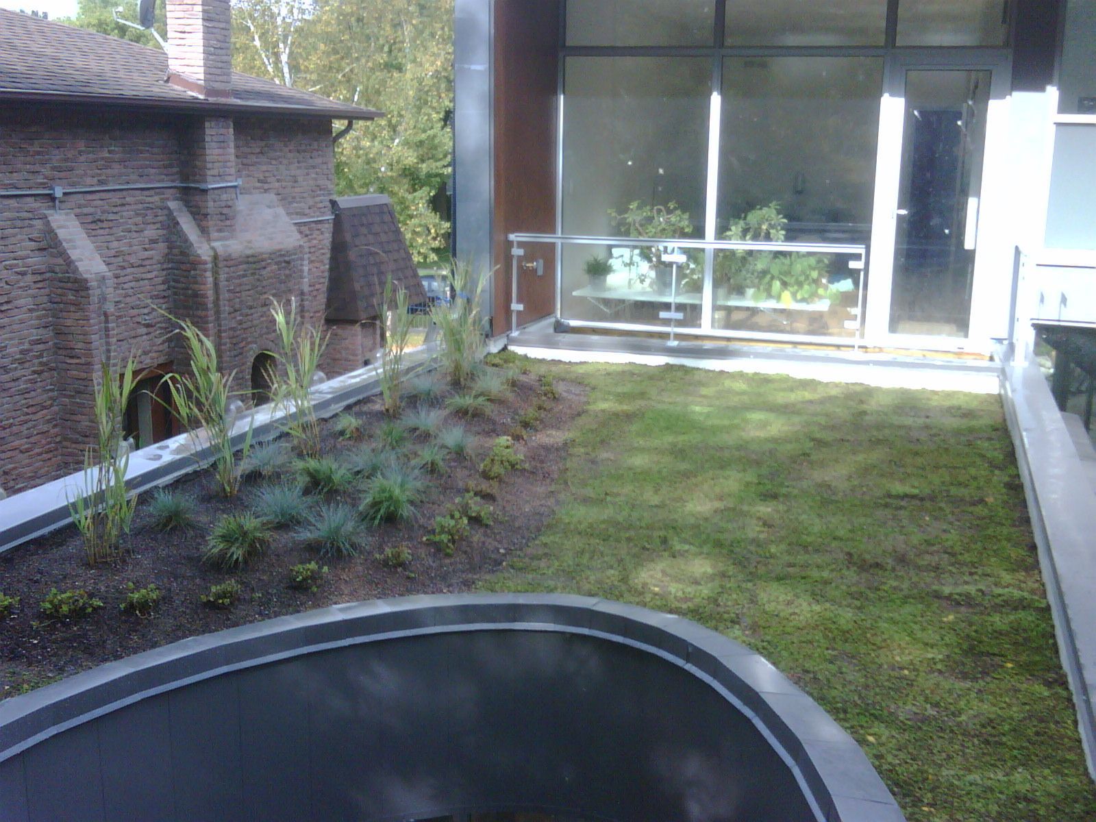 A house with a large lawn in front of it