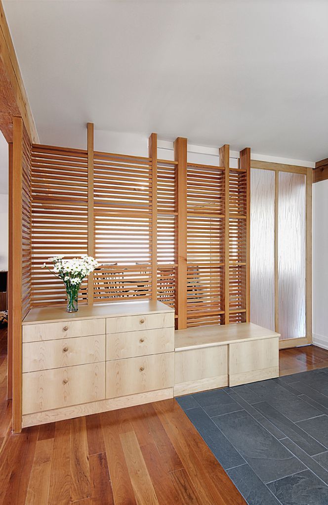 There is a vase of flowers in the middle of the room.