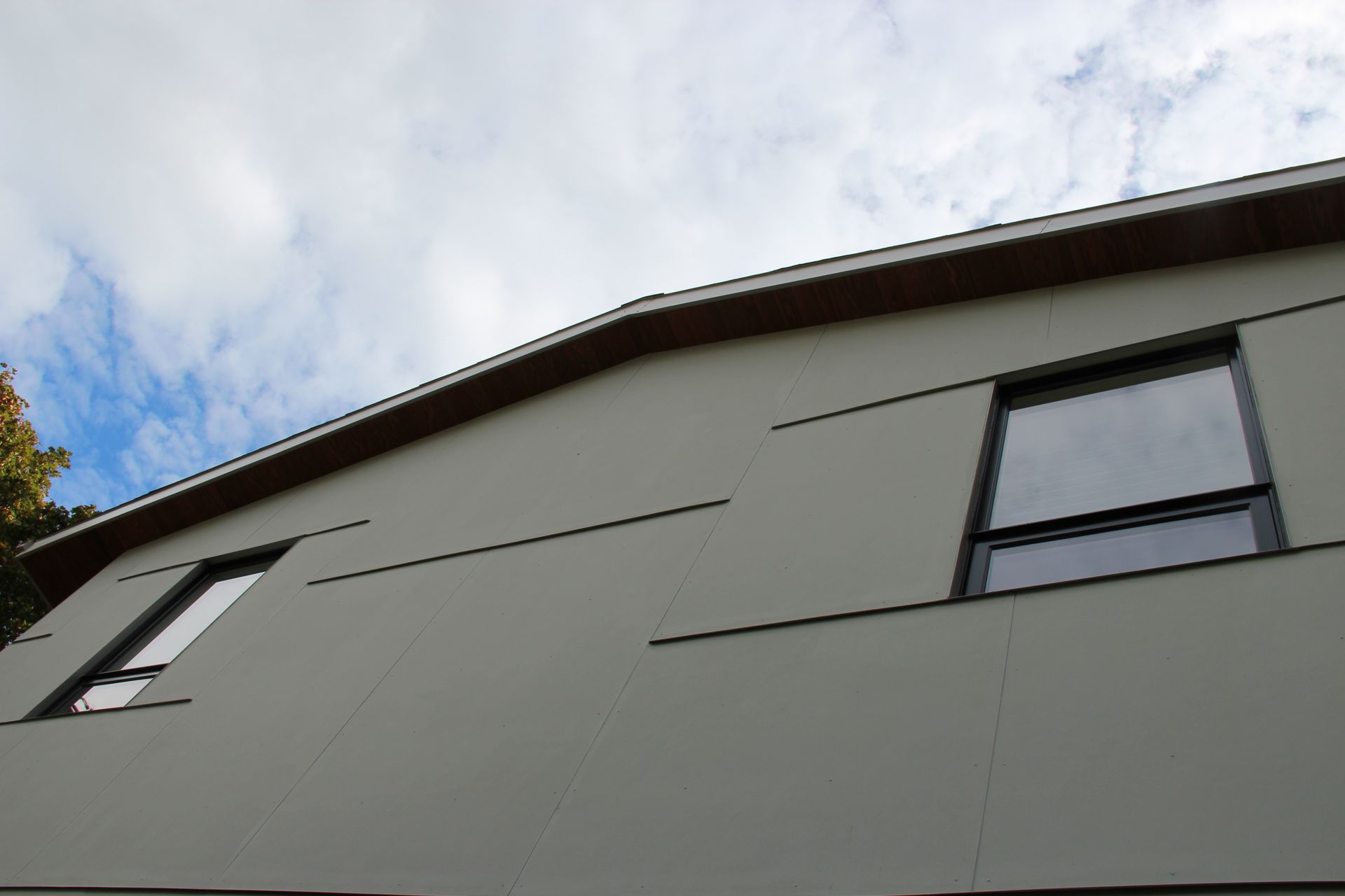 Looking up at a building with a blue sky in the background