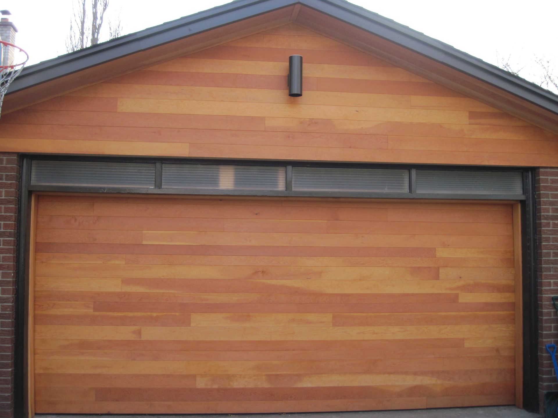 A wooden garage door with the number 1 on it