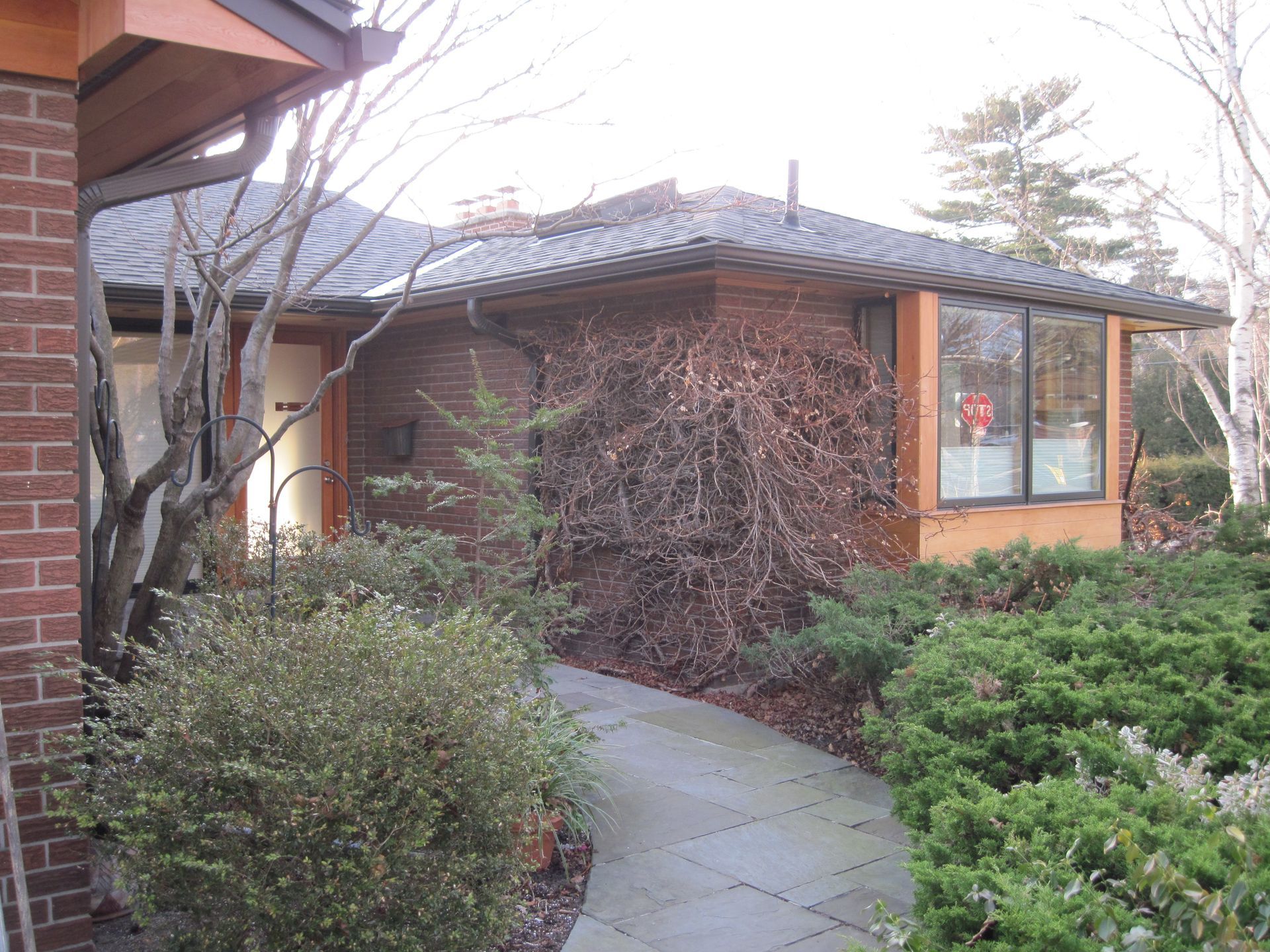 A brick house with a walkway leading to it