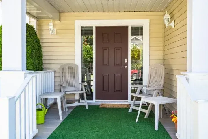 Front porch with artificial grass rug.