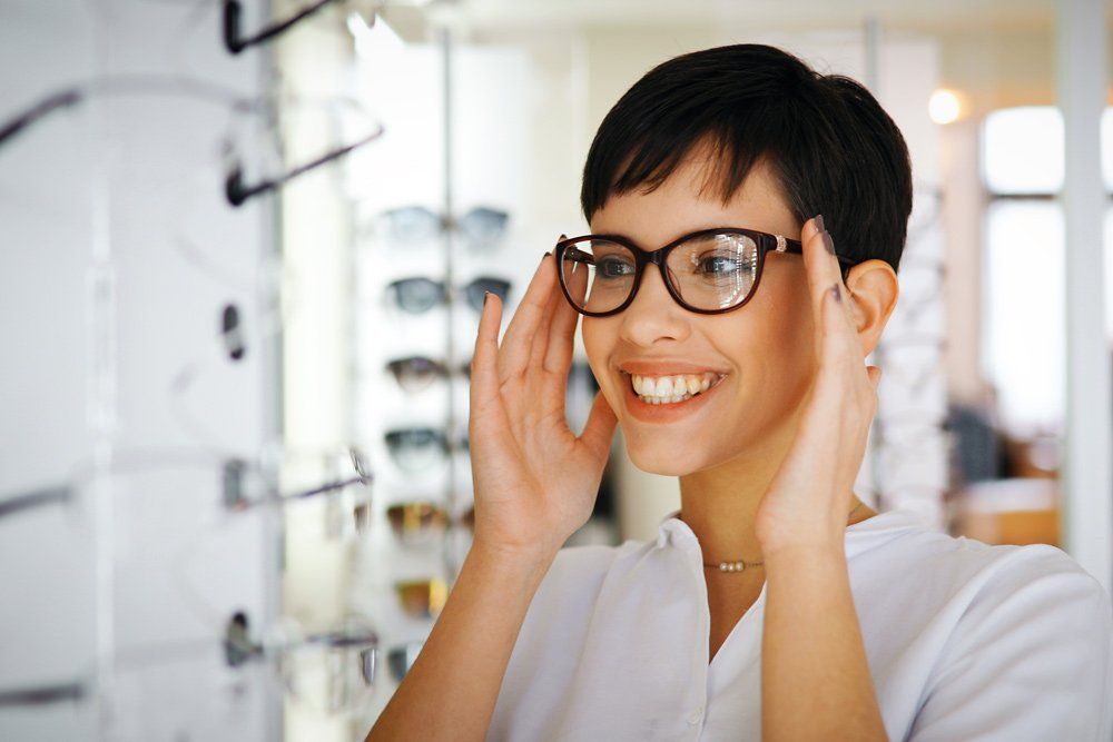 Woman Trying New Eyeglasses — Springfield, MA — Forest Park Eye Care, PC